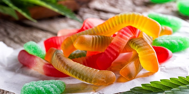 An assortment of CBD gummies showcasing different shapes and colors.