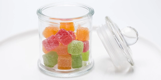 Close-up of THC-infused gummies highlighting their texture and colors.