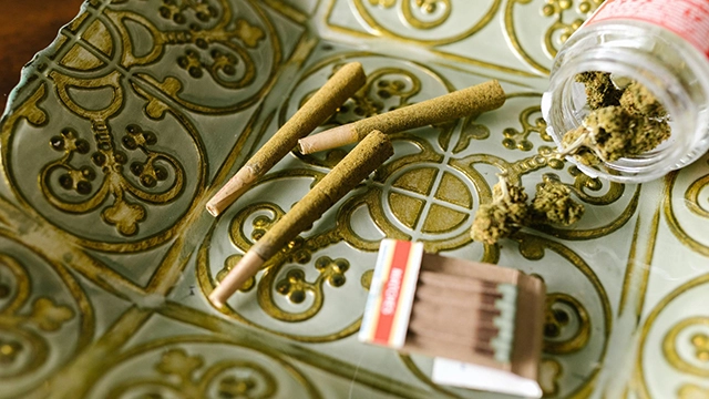 A collection of cannabis oil and kief, essential components for enhancing the potency of infused pre-rolls.