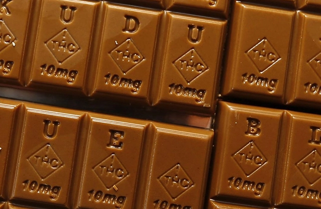 A chocolate bar with THC engraved on each piece, indicating cannabis infusion