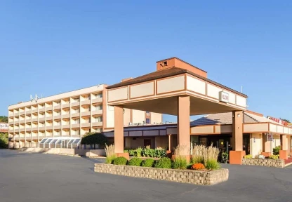Modern hotel building with multiple floors and spacious parking in Agawam