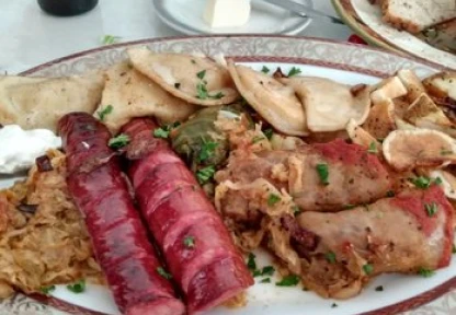 A plate of grilled meats and sausages, typical of a hearty local meal, suggesting a popular dining spot in Enfield.