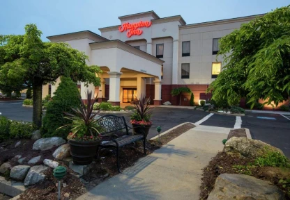 Exterior of the Hampton Inn hotel in Chicopee with landscaped entrance