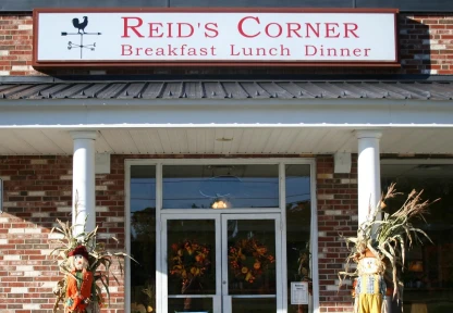 A welcoming diner entrance with autumn decorations, indicating a local eatery that's a favorite among Hampden residents.